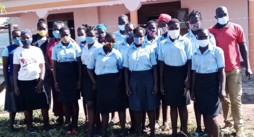 Angatunyo Lioness Girls and tutors in front of the new program centre.